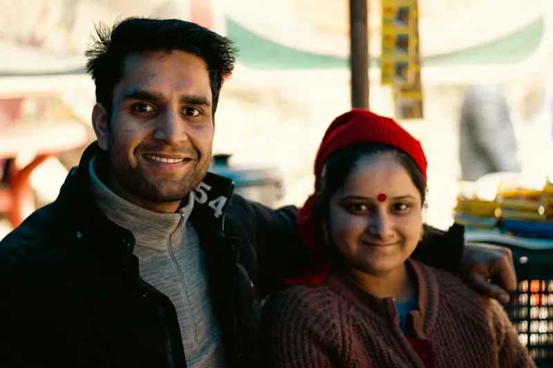 A smiling young couple out shopping together